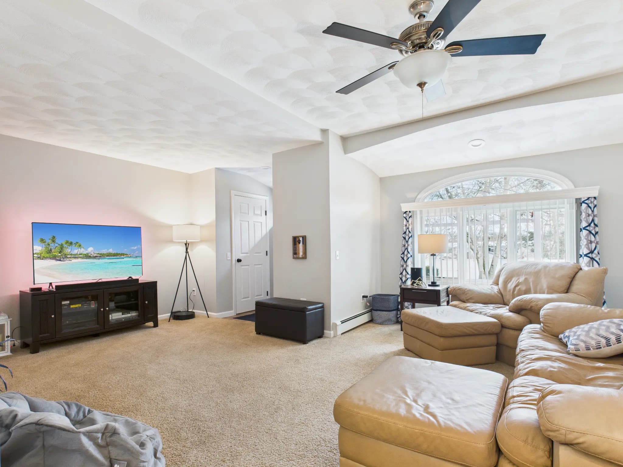 Finished lower-level living area real estate photography sample